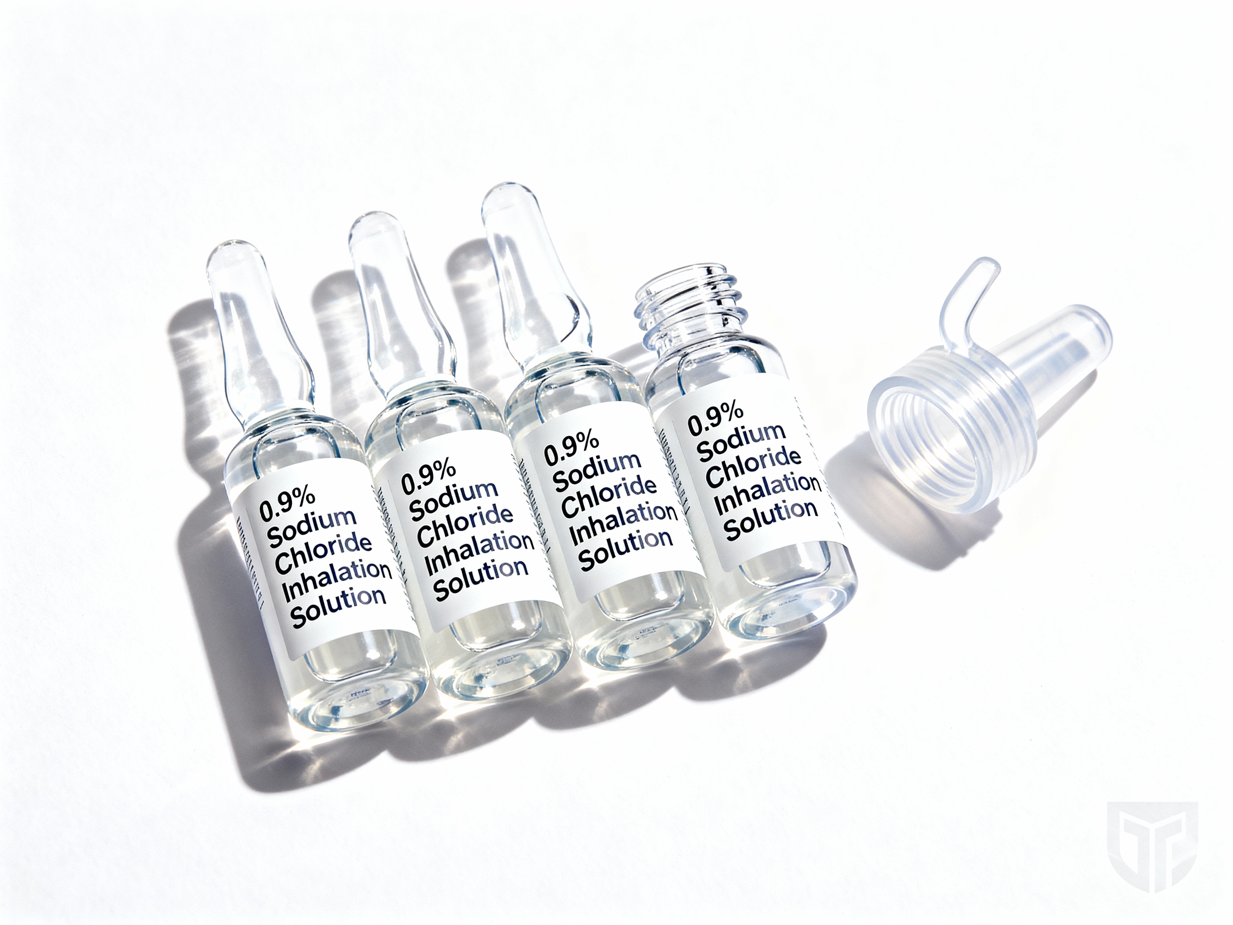 0.9% Sodium Chloride Inhalation Solution unit-dose vials next to a nebulizer mouthpiece.